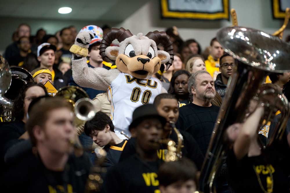 Rodney the Ram leads the charge with the VCU Peppas at a home basketball game
